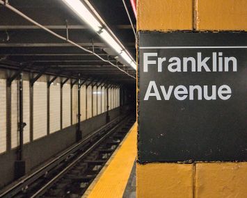 Franklin Avenue sign on platform inside subway station