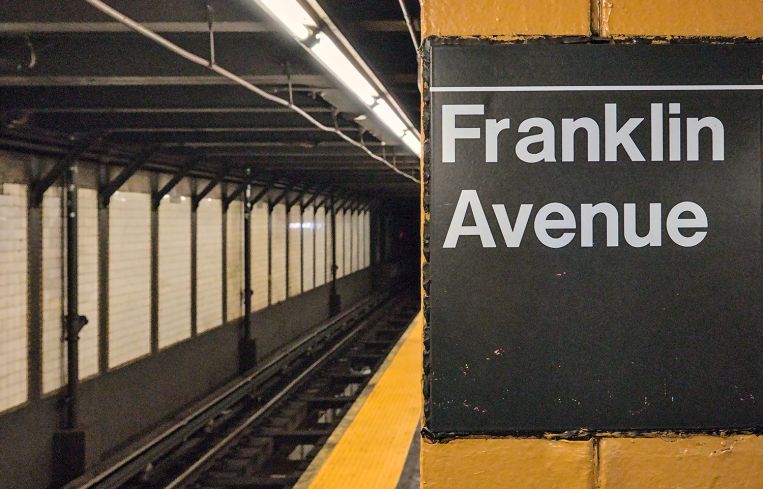 Franklin Avenue sign on platform inside subway station