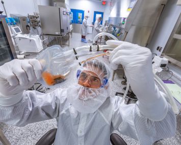 A process engineer at Lonza Biologics examines blood samples in the lab.