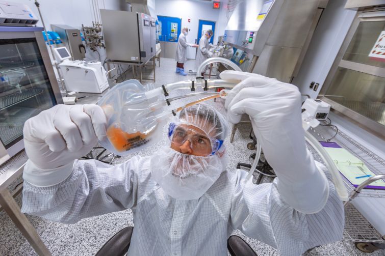 A process engineer at Lonza Biologics examines blood samples in the lab.