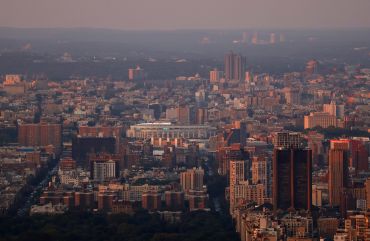 The sun sets on Yankee Stadium in the Bronx, seen from the 86th floor of the Empire State Building in August 2023. 