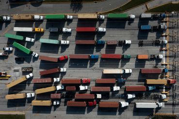 Trucks transport cargo containers