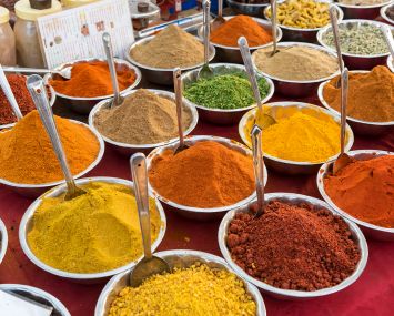 Spices, herbs and curry powders on display.