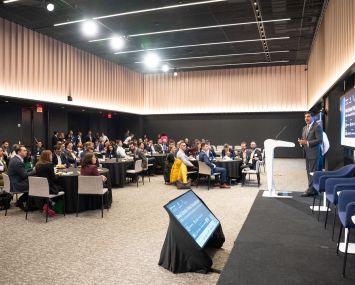 Sam Chandan, founder of the Real Estate Pride Council, speaks at the group’s now annual conference at Deutsche Bank’s Manhattan offices in April. The event drew more than 350 attendees from over 150 firms. A kickoff dinner two years ago drew about 25 people.