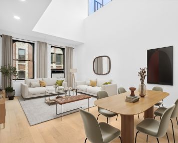 A living room with a skylight.