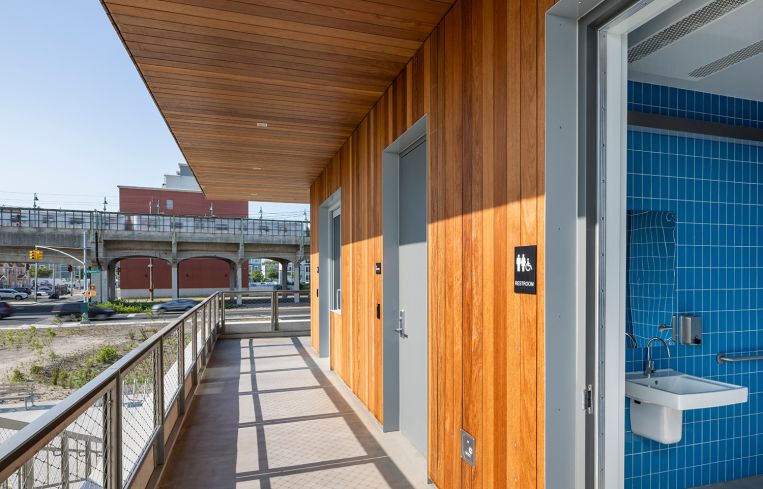 A view of the porch of the Welcome Center looking towards the Beach 44th Street subway platform.