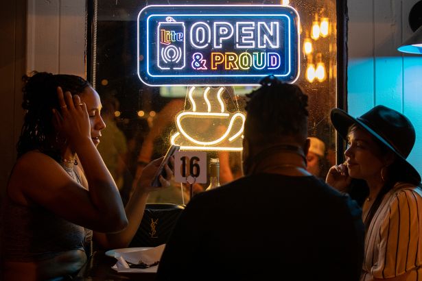 People sit in the outdoor patio of As You Are in Washington, D.C., on June 4, 2022.