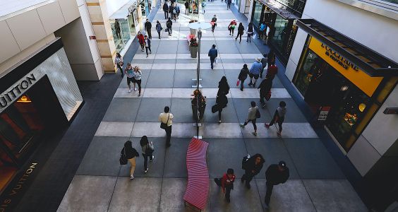 Shoppers walk between stores at Santa Monica Place in Santa Monica.