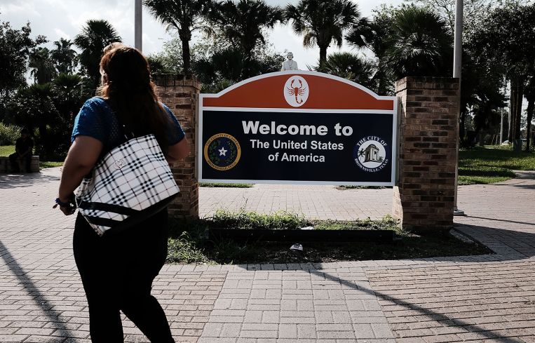 A sign welcomes people to the United States.