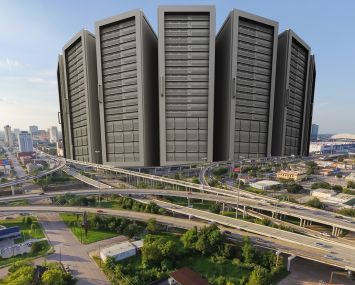 Aerial view downtown and interstate 45 and 69 highway intersection, massive intersection, stack interchange and elevated road junction overpass at sunset from the southeast side of Houston, Texas, USA