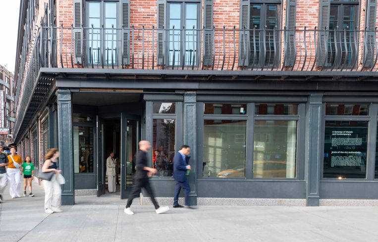 A storefront at the bottom of a brick building.