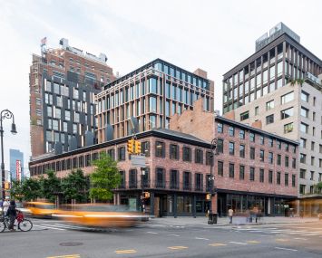 Row houses and a glass office tower in Manhattan.