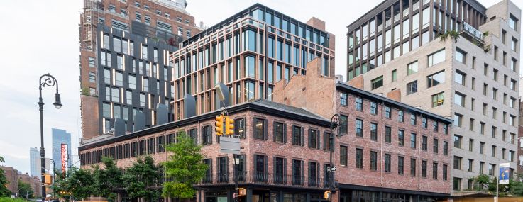 Row houses and a glass office tower in Manhattan.