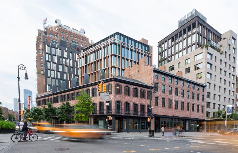 Row houses and a glass office tower in Manhattan.