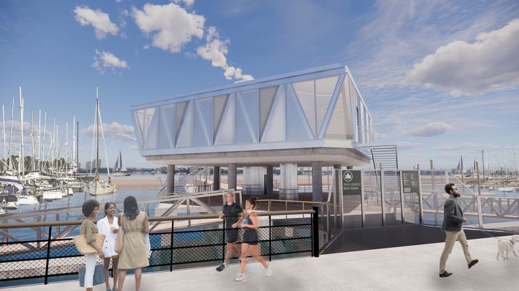 People running on the waterfront past a dock house on trusses over the water.