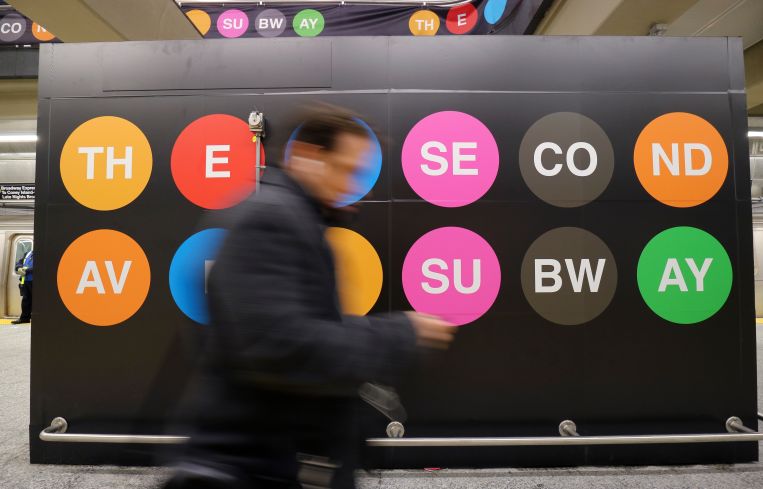 A man walks along the platform at the 96th Street station on the Second Avenue subway line.