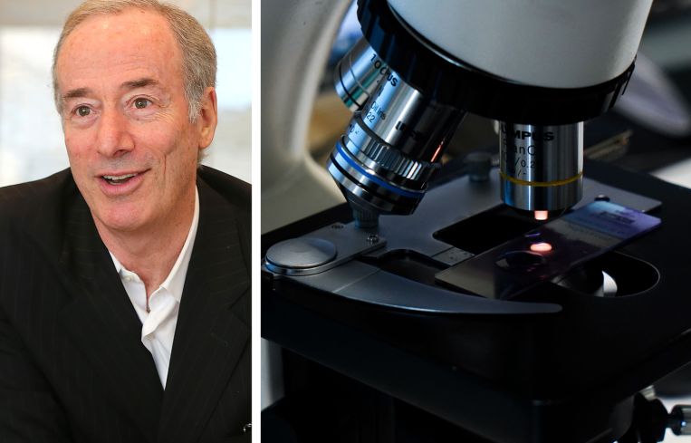 Alexandria Real Estate Equities Founder and Chairman Joel Marcus and a microscope