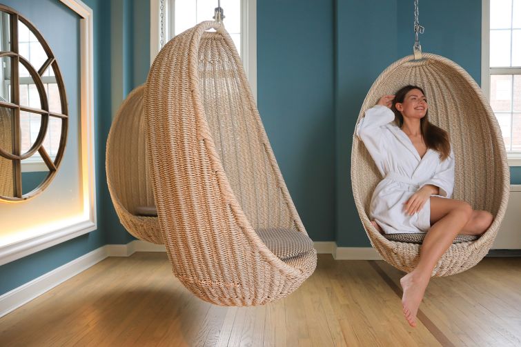 A person sitting in a chair in a day spa.