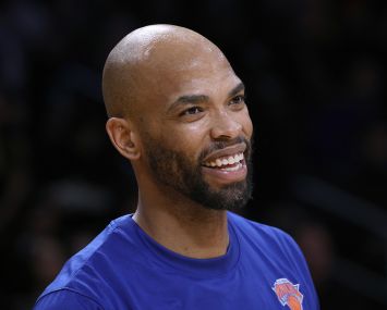 Taj Gibson smiles during warm-ups
