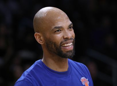 Taj Gibson smiles during warm-ups