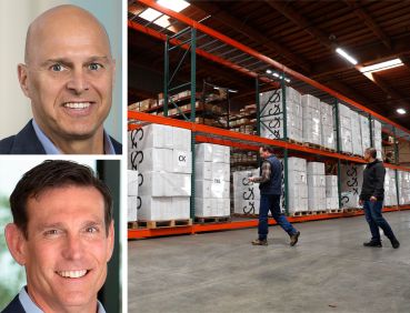 Overton Moore Properties Managing Partner and CEO Timur Tecimer, Partner and CIO Peter Cassiano, workers inside a warehouse.