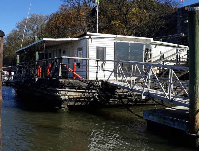 A dock house on a floating barge.