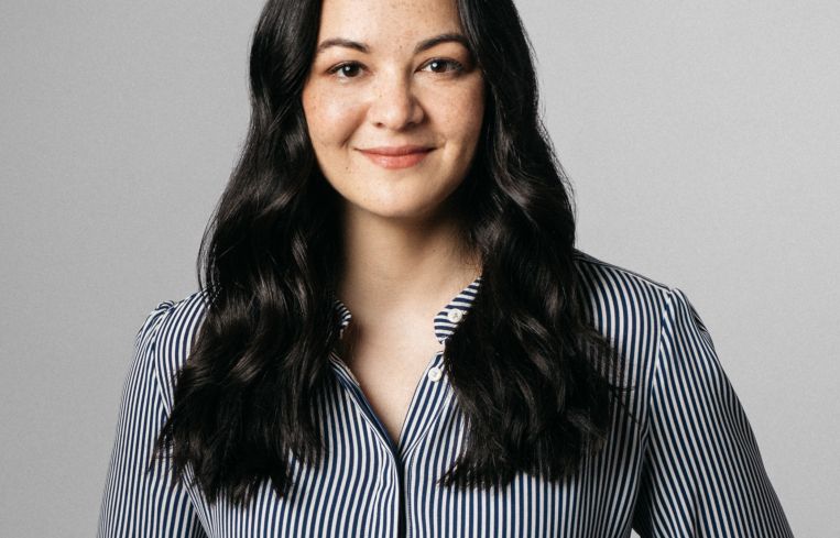 A woman smiling.