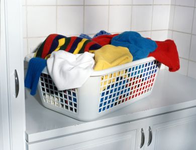 Some clothes heaped in a basket.