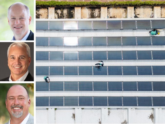 Legence CEO Jeff Sprau, AMA Group CEO Arthur Metzler, CMTA CEO Jimmy Benson, and workers install solar panels on a rooftop.