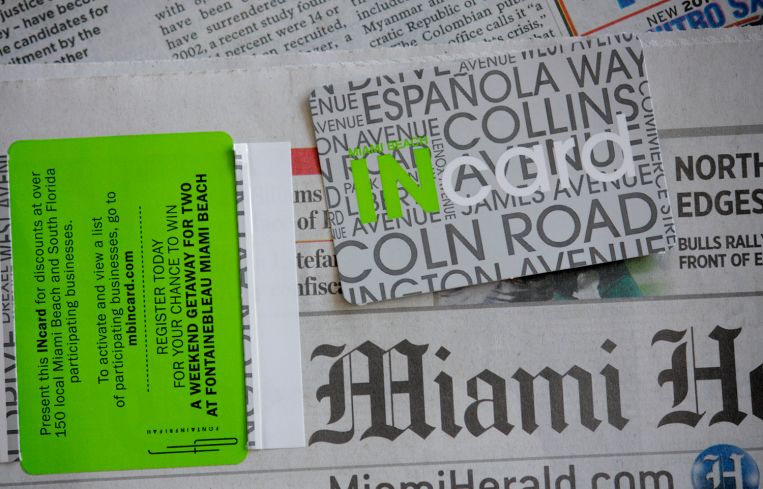 A Miami Herald newspaper and incard.