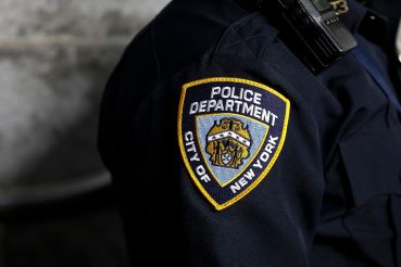 A New York City Police Department patch is seen on an officer's uniform.