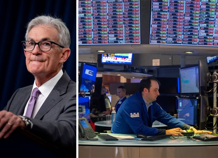 Federal Reserve Chairman Jerome Powell. Traders work on the floor of the New York Stock Exchange.