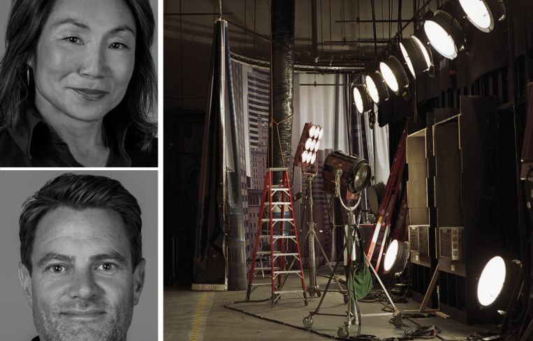 Bungalow Projects co-founders Susi Yu and Travis Feehan, and stage lights behind a film set.