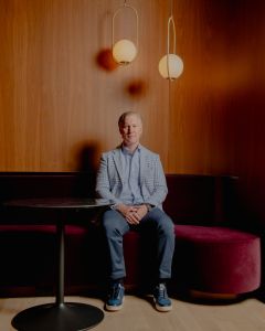 Wes Rogers sitting on a chair.