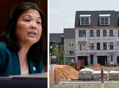 Acting Secretary of Labor Julie Su and townhouses under construction.