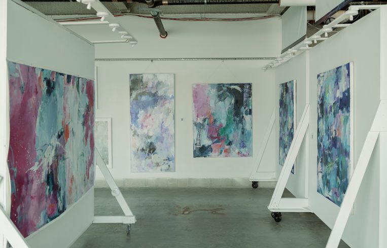 Paintings hanging in an office building.