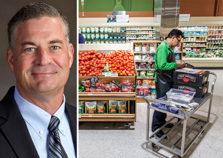 Publix CEO Kevin Murphy and a Publix employee stocks shelves in one of the company's supermarkets.