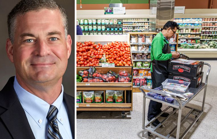 Publix CEO Kevin Murphy and a Publix employee stocks shelves in one of the company's supermarkets.