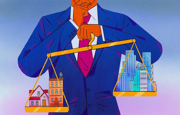 Cartoon of a man in a suit holding a scale weighed down on each side with buildings.