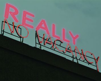A sign above a hotel that reads "Really No Vacancy."