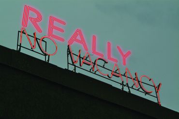 A sign above a hotel that reads "Really No Vacancy."