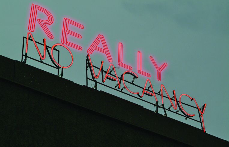 A sign above a hotel that reads "Really No Vacancy."