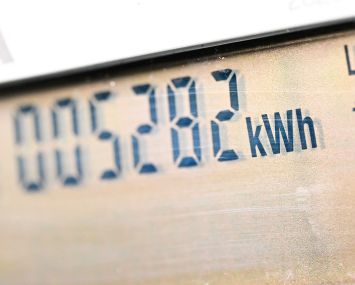 An energy meter with digital numbers on it.