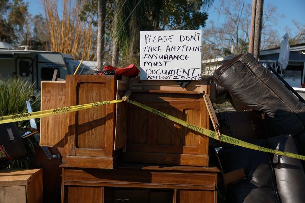 A sign reading "You loot, I shoot" in Florida.