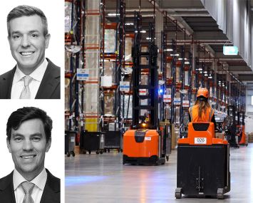 JLL's Kevin MacKenzie and Brian Trop, and workers in a warehouse.