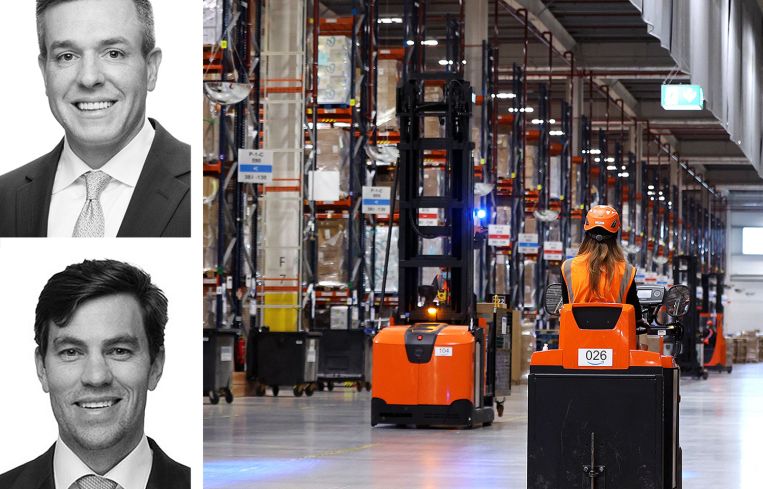 JLL's Kevin MacKenzie and Brian Trop, and workers in a warehouse.