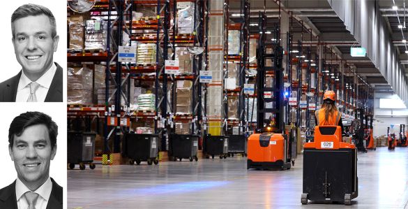 JLL's Kevin MacKenzie and Brian Trop, and workers in a warehouse.