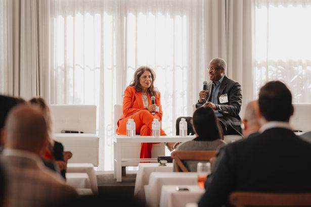 Ramola Motwani and Al Dotson at a panel.