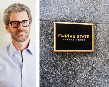 Anthony Malkin, CEO of Empire State Realty Trust, and their logo on a plaque.
