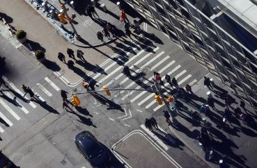 Pedestrians cross an intersection in Manhattan.